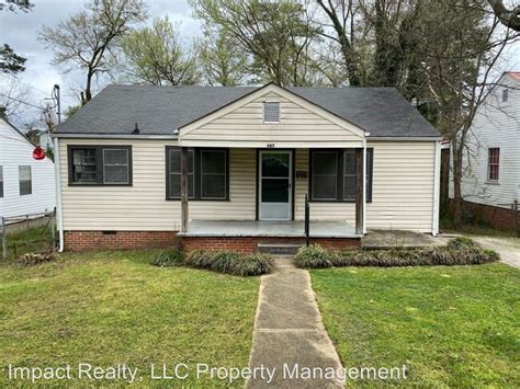 210 E 28th St, Anniston, AL 36201 - Single level, 2 bedroom, 1 bath home featuring kitchen with range and fridge, dining room, living room, and laundry room. . Houses for rent in gadsden al